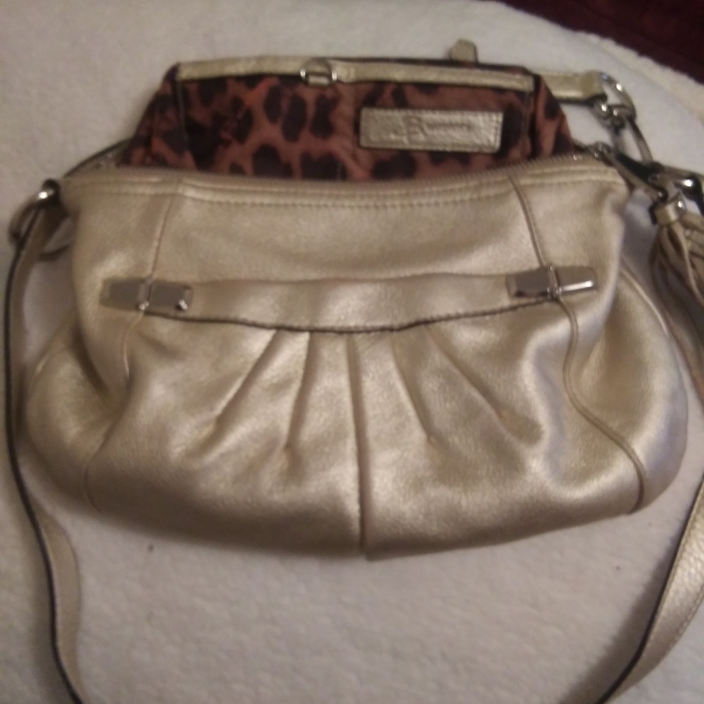 B Makowsky gold purse.